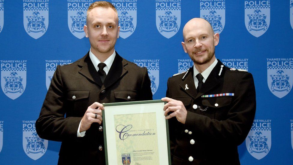 Sgt Thomas Thornton smiling with Chief Constable Jason Hogg