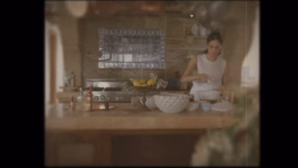 Meghan, Duchess of Sussex, in a kitchen surrounded by mixing bowls and other equipment