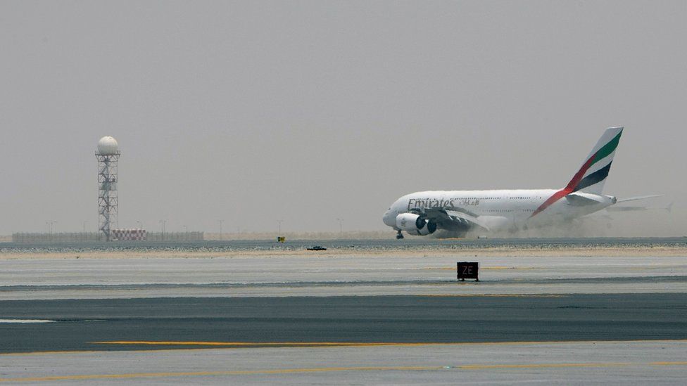 Emirates airlines plane on the runway at Dubai airport