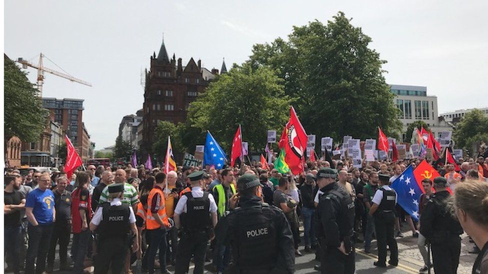 Smoke bombs thrown during Belfast demonstrations BBC News
