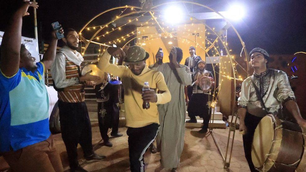 Musicians perform as people gather for iftar, fast-breaking meal, during the Muslim holy fasting month of Ramadan in a park in Khartoum, Sudan - 8 April 2023