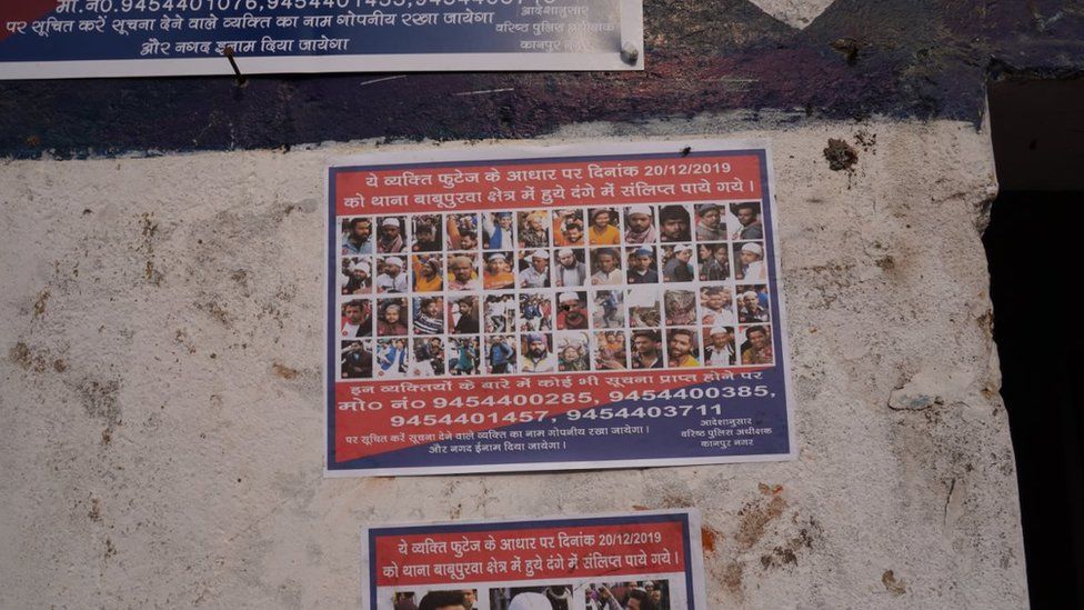 Posters of "wanted people" outside a police station