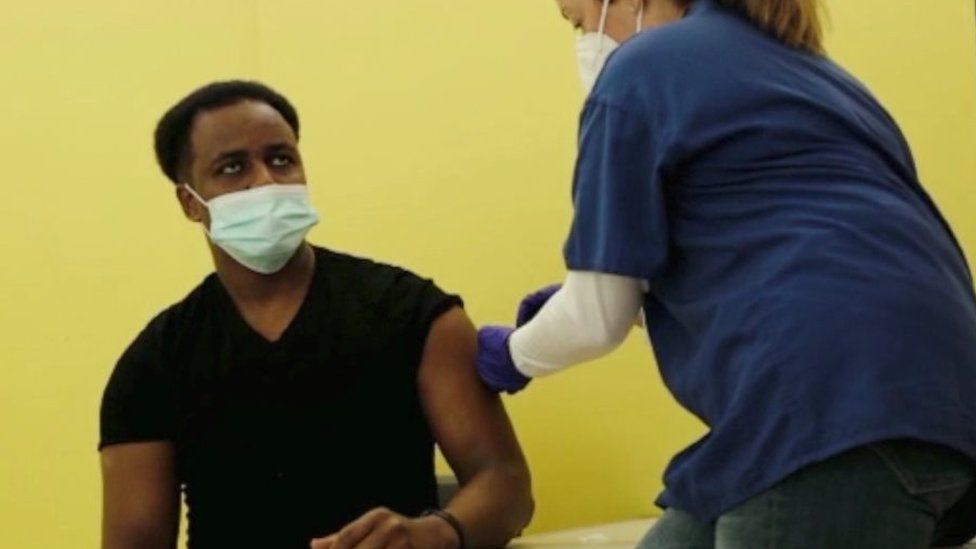 A vaccinator injects the vaccine