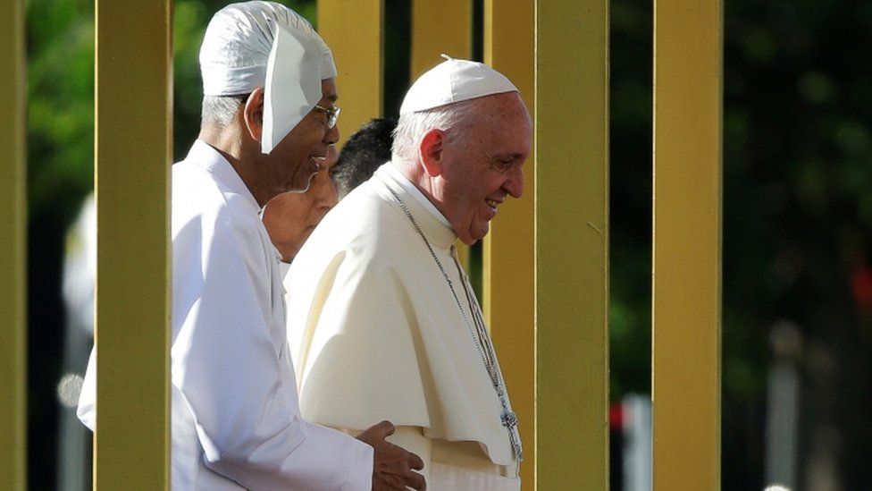Pope Francis was welcomed to the capital by President Htin Kyaw (L)