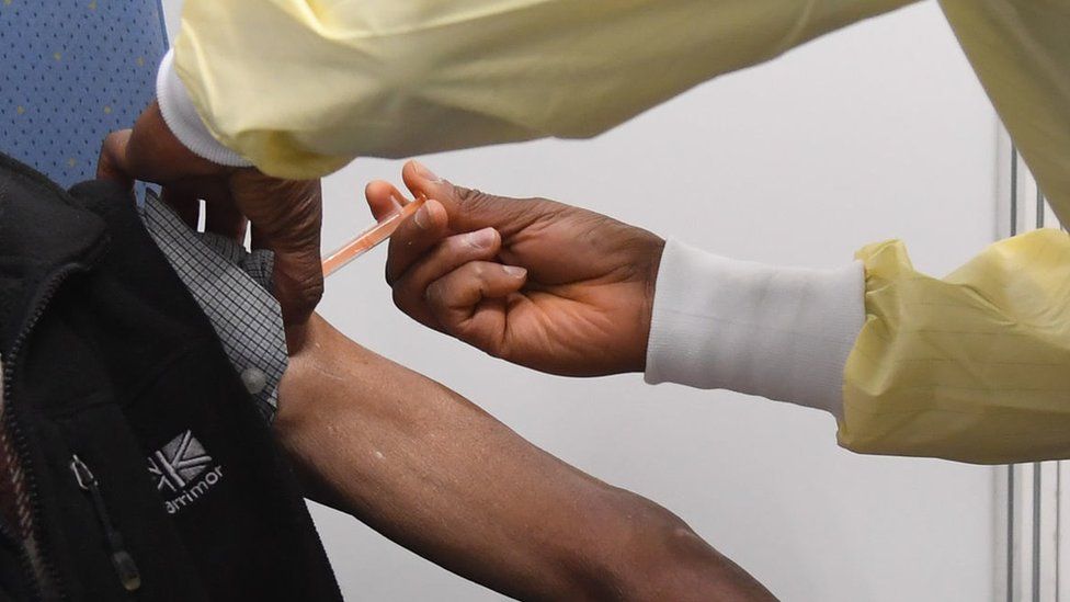 A man receiving the vaccine