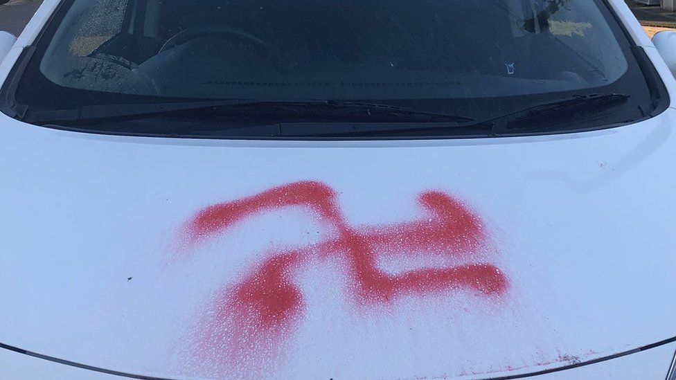 Swastika sprayed on car