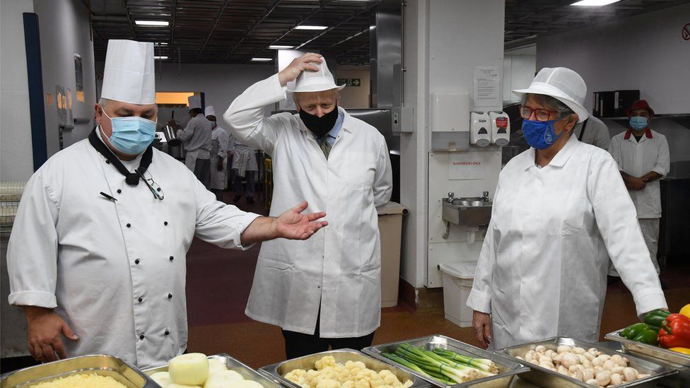 A chef at the Royal Berkshire Hospital, left, with Boris Johnson, centre, and Prue Leith, right