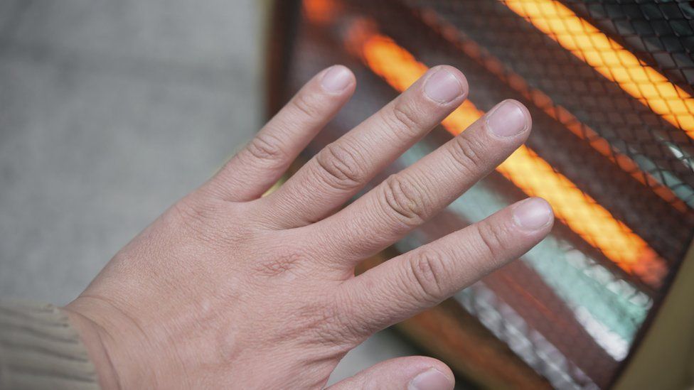 hand in front of fire