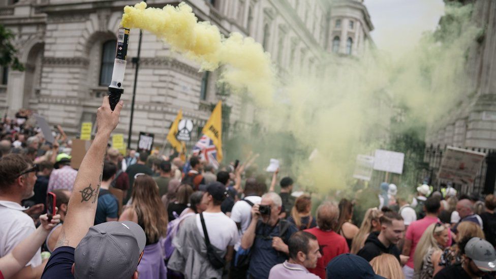 Protesters let off flares outside Downing Street