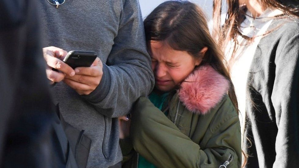 A young girl cries after the incident in New York