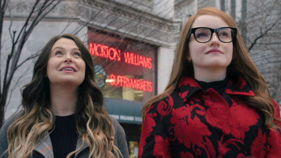 Katie Lowes as Rachel (left) and Julia Garner as Anna Delvey in Inventing Anna