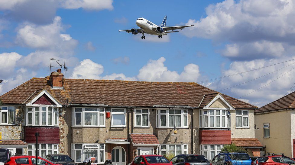 Plane flying over homes near Heathrow airport