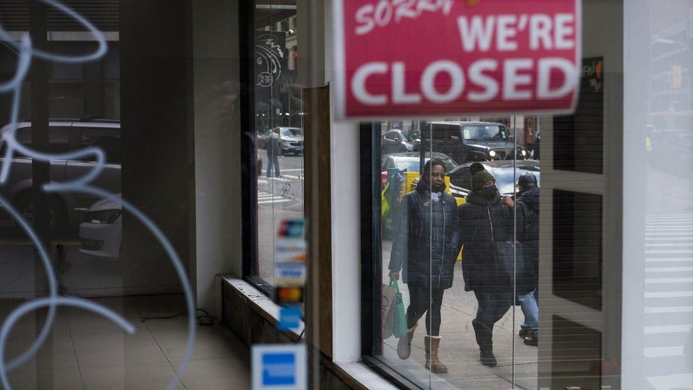 Pedestrians walk past a closed store in New York, New York, USA, on 08 January 2021. The United Statesâ€™ Bureau of Labor Statistics released data today showing that the US economy lost 140,000 jobs in December and that the unemployment rate is at 6.7 percent as businesses continue to struggle with the economic impact of the coronavirus pandemic