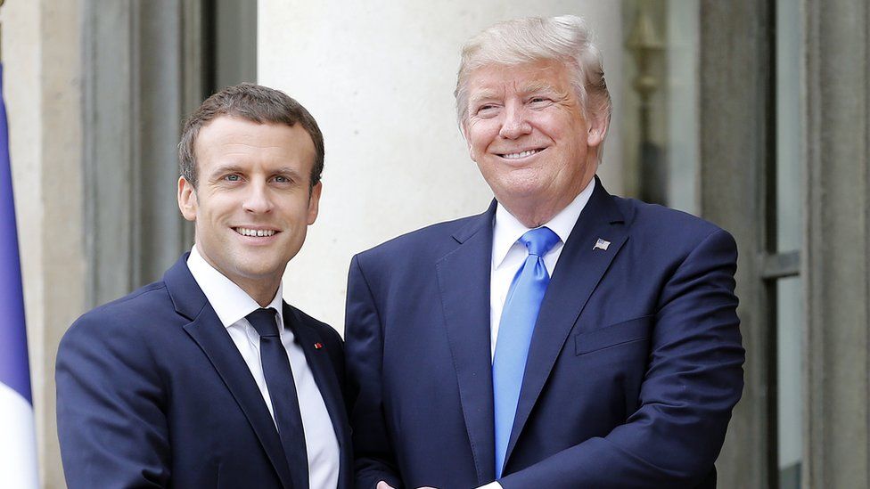 French President Emmanuel Macron welcomes US President Donald Trump prior to a meeting at the Elysee Palace