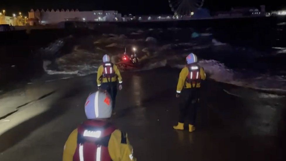 RNLI crew launch a boat for a sea rescue in Blackpool