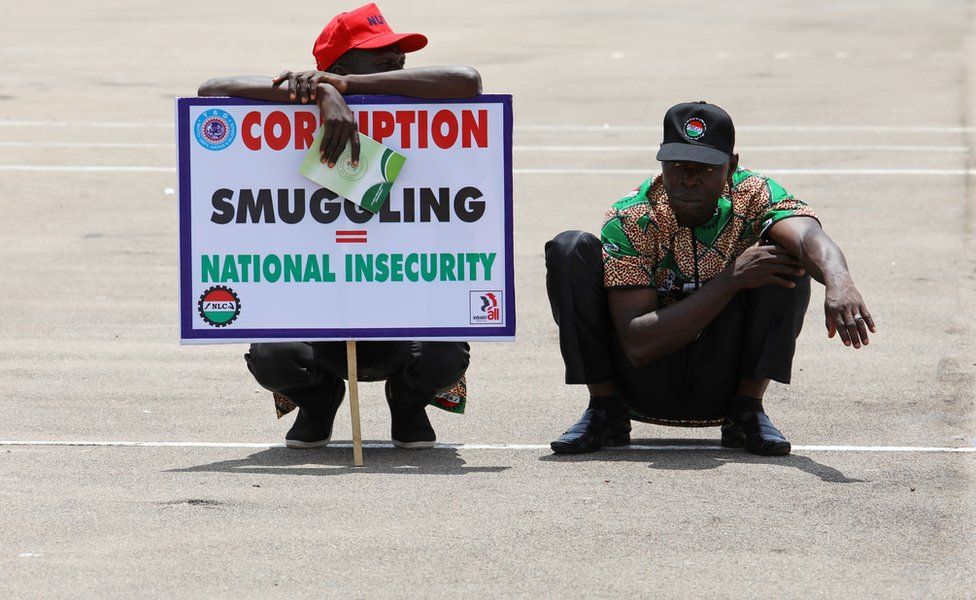 Members of the Nigeria Labour Congress (NLC) hold a placard at Eagle Square during a May Day rally in Abuja, Nigeria May 1, 2017.