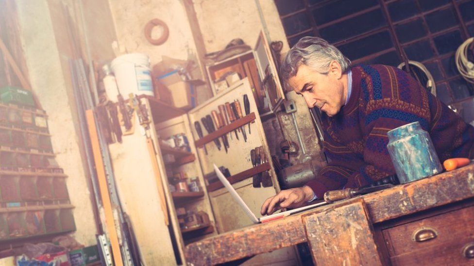 Carpenter working on his laptop