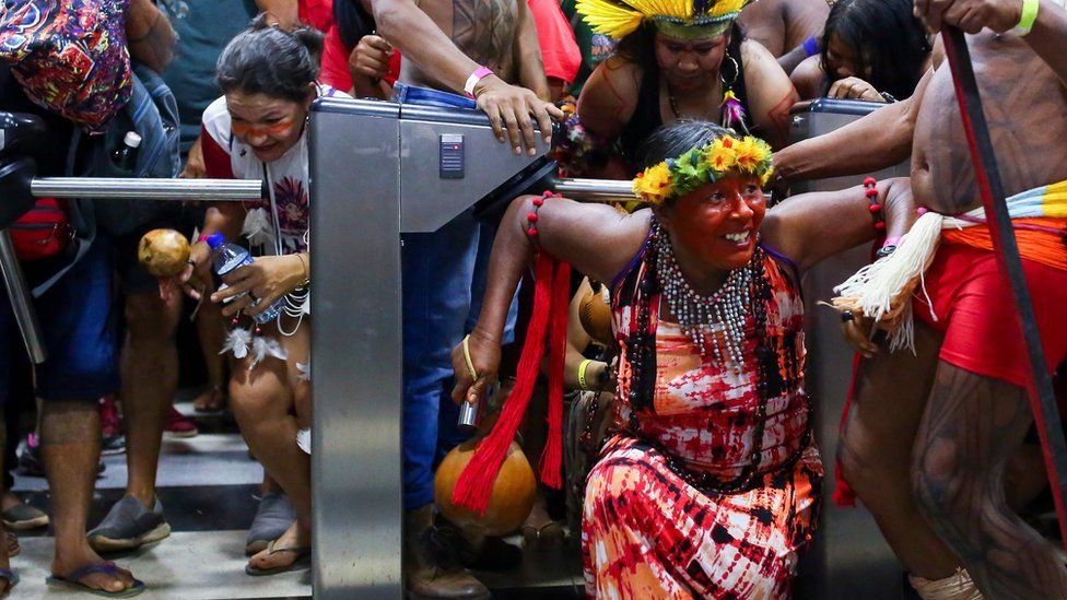Brazilian indigenous break into the Ministry of Health office during a protest against budget cuts