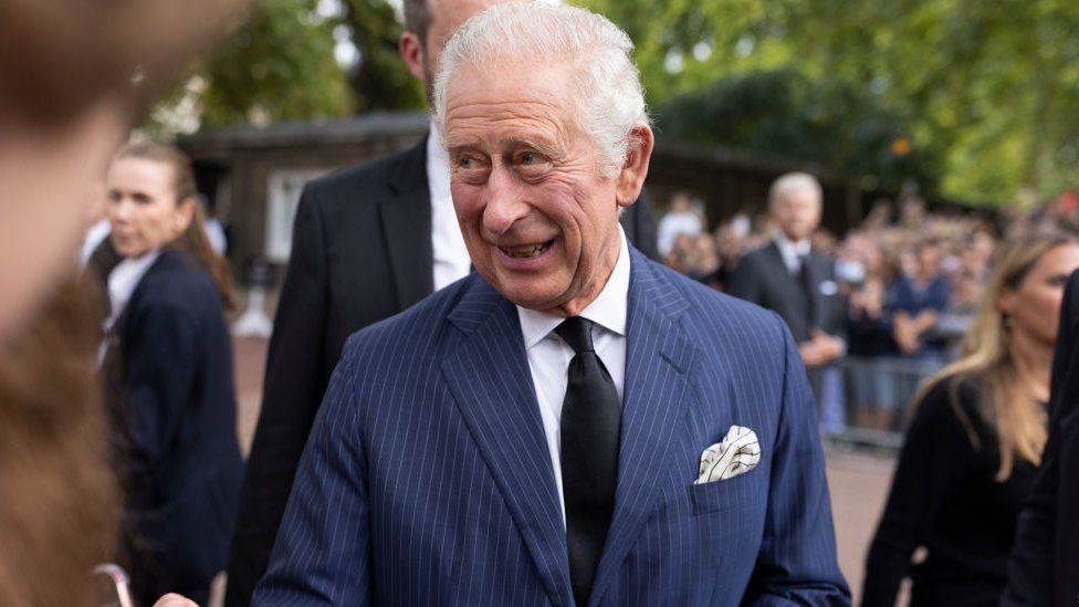 GRAVESEND, UNITED KINGDOM - SEPTEMBER 10: King Charles III greets members of the crowd along the Mall during an impromptu walkabout following the death of Queen Elizabeth II