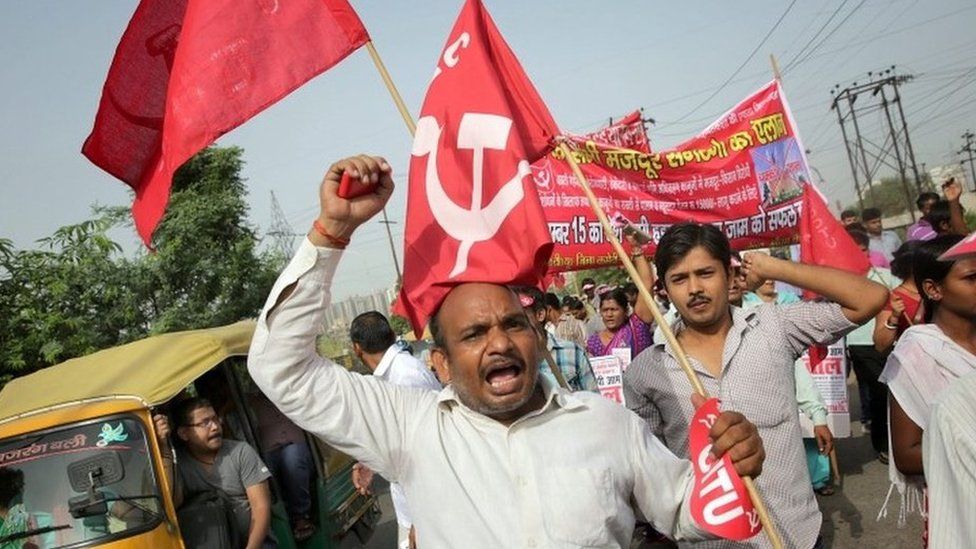 Indian trade union members shout anti government slogans as they participate in a protest near the Noida industrial area in Uttar Pradesh, India during the nationwide strike on 02 September 2015.