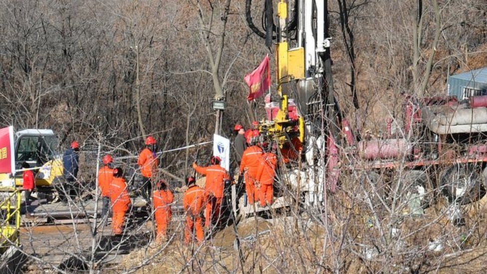 Members of a rescue team work at the site of a gold mine explosion where 22 miners are trapped underground in Qixia, in eastern China's Shandong province on January 18, 2021.