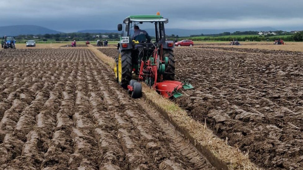 tractor ploughing field at championships in Limavady