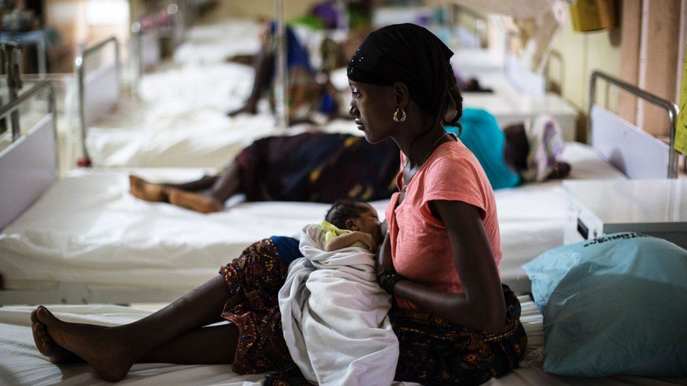 A mother nurses her newborn at the maternity ward of the Kailahun Government hospital on April 26, 2016, eastern Sierra Leone.