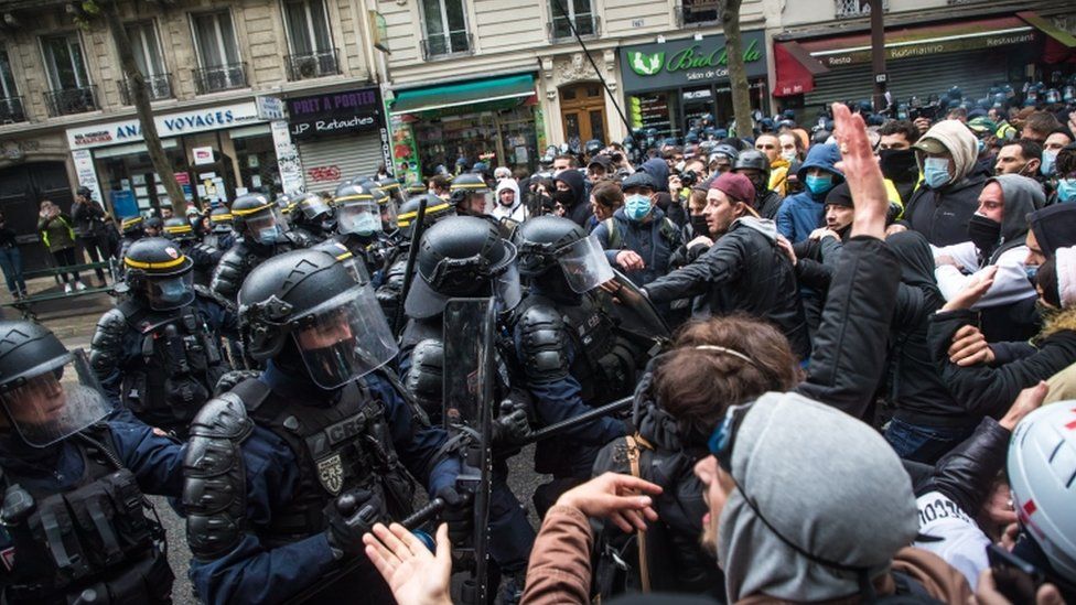 French anti riot Police forces face protesters as clashes erupt during the annual May Day march in Paris