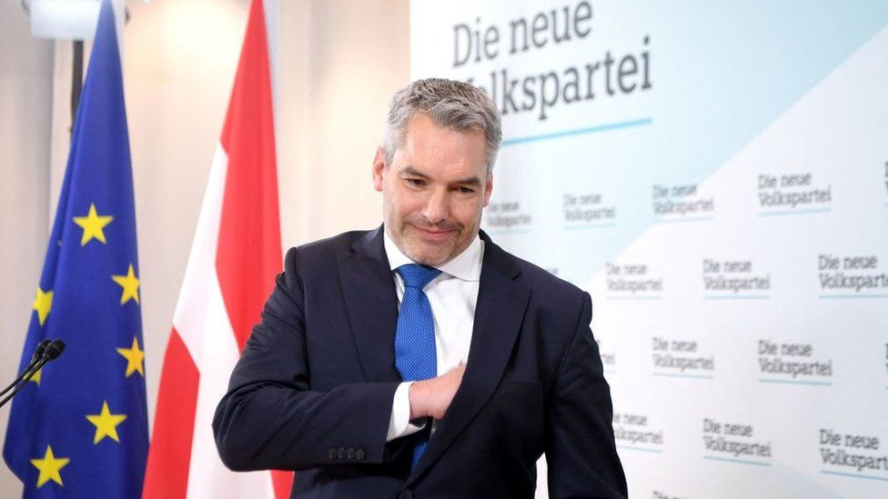 Austria's Interior Minister Karl Nehammer leaves a press conference after he was named as new party head and also as Austria's new chancellor in Vienna on December 3, 2021