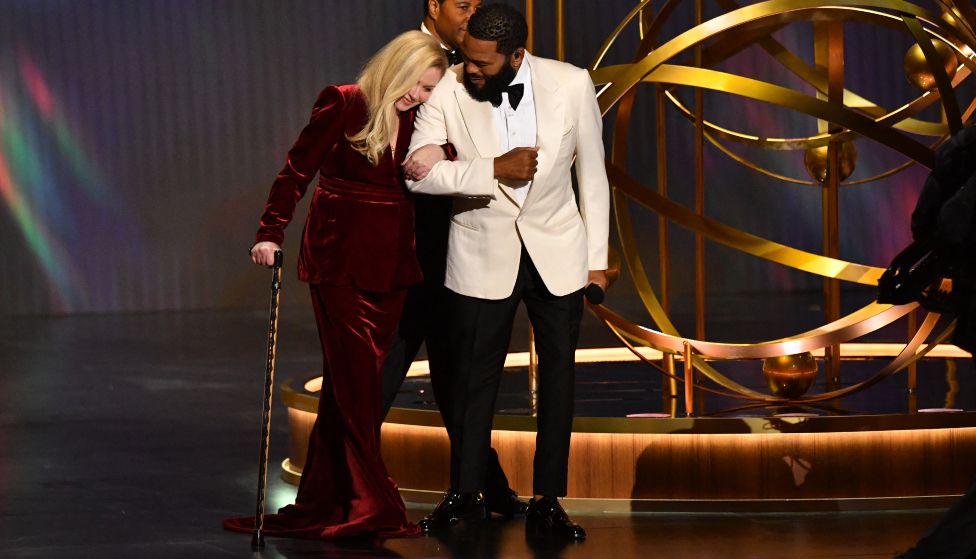 Actor Anthony Anderson and US actress Christina Applegate arrive onstage during the 75th Emmy Awards at the Peacock Theatre at L.A. Live in Los Angeles on January 15, 2024