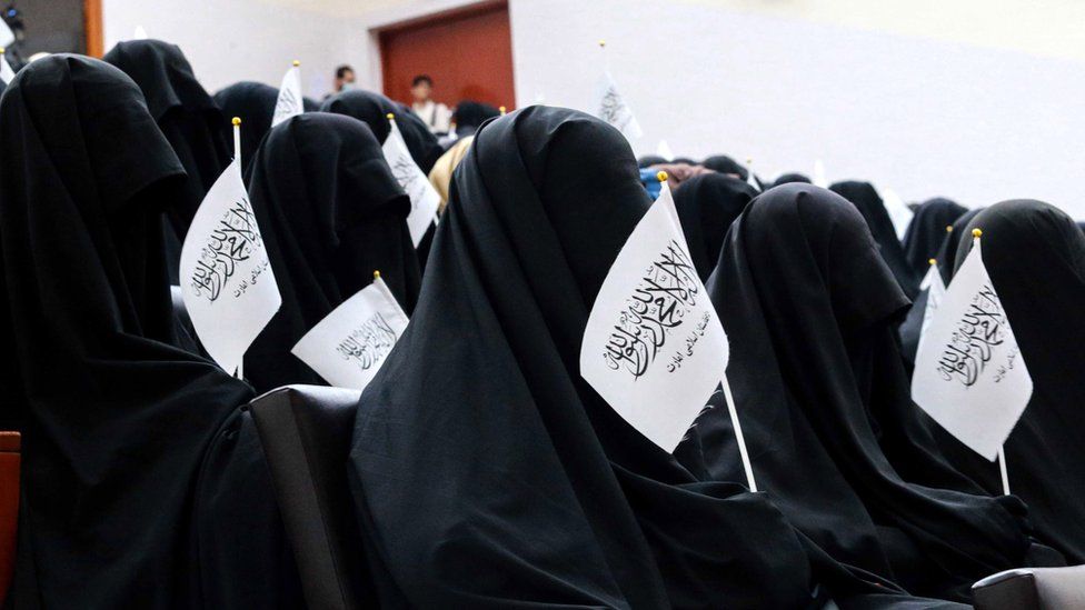 Afghan students listen to women speakers prior to a pro-Taliban rally outside the Shaheed Rabbani Education University in Kabul on 11 September 2021
