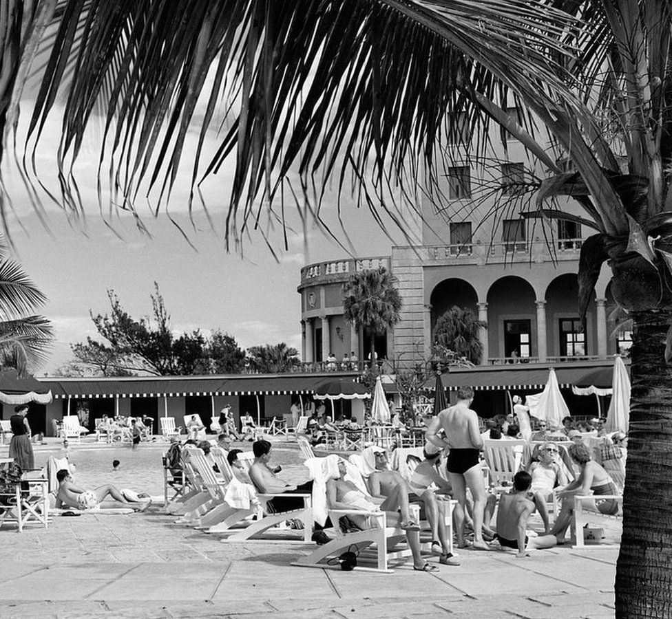 Tourists at the swimming pool of Havana's Hotel Nacional