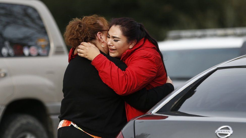 Vanessa Flores (R) embraces another woman after she leaves the locked down Veterans Home of California during an active shooter turned hostage situation on March 9, 2018 in Yountville, California.
