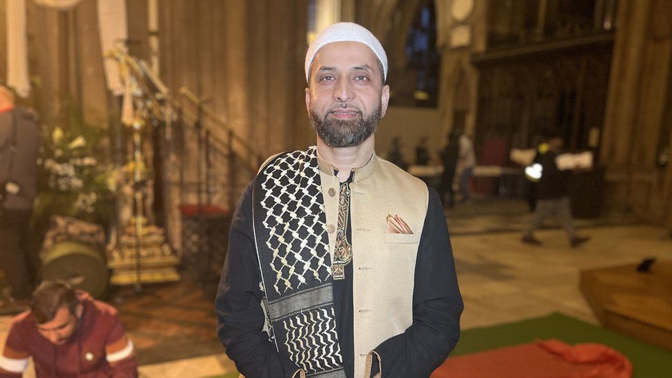 Mohammad Islam standing in the cathedral
