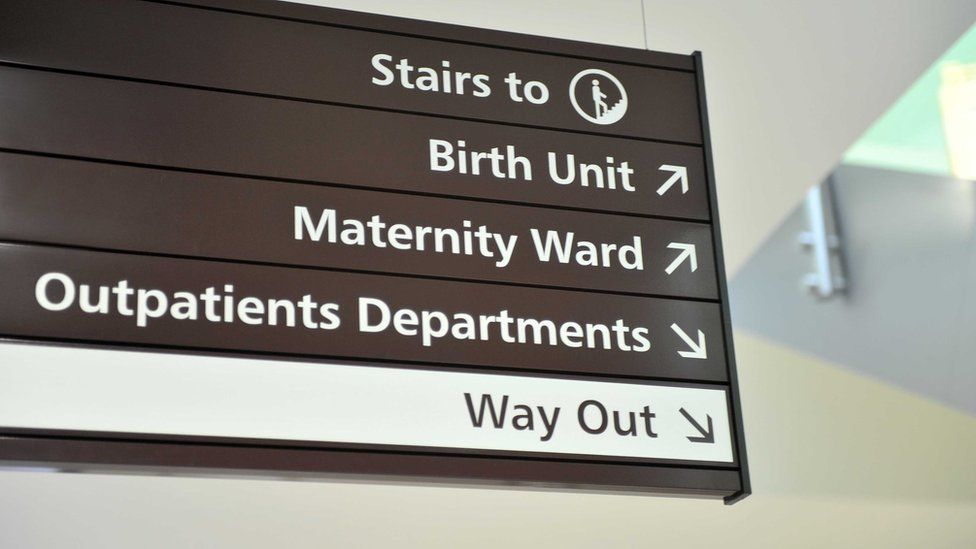 Hospital sign pointing to a maternity ward