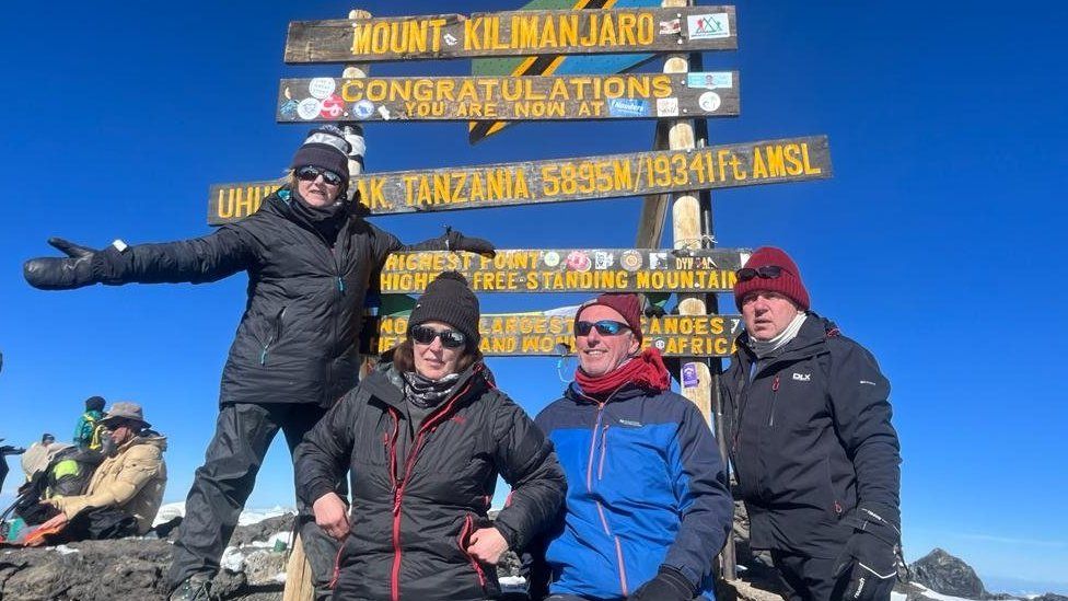 Gillian Millane and family at the top of Mount Kilimanjaro