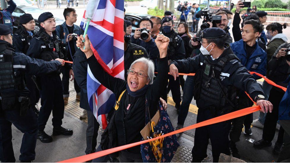 Activist Alexandra Wong, also known as Grandma Wong, shouts slogans outside the West Kowloon court on the opening day of the trial of pro-democracy media tycoon Jimmy Lai in Hong Kong on December 18, 2023.