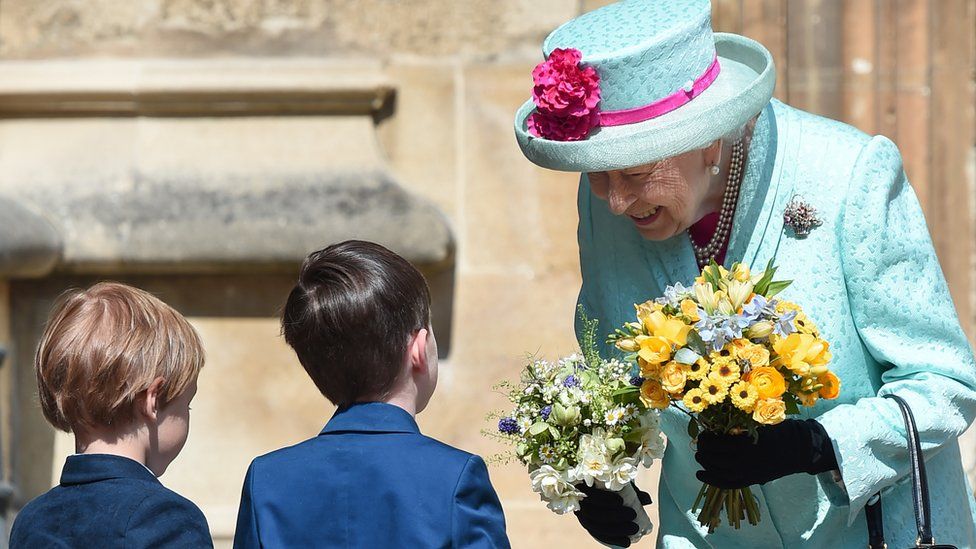 The Queen was presented with flowers as she left St George's Chapel
