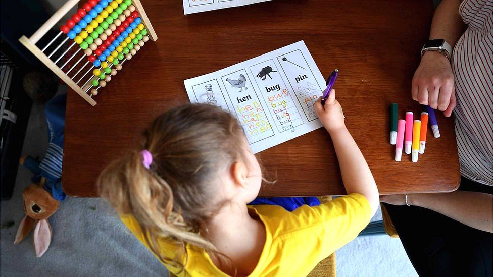 Four year old doing school work