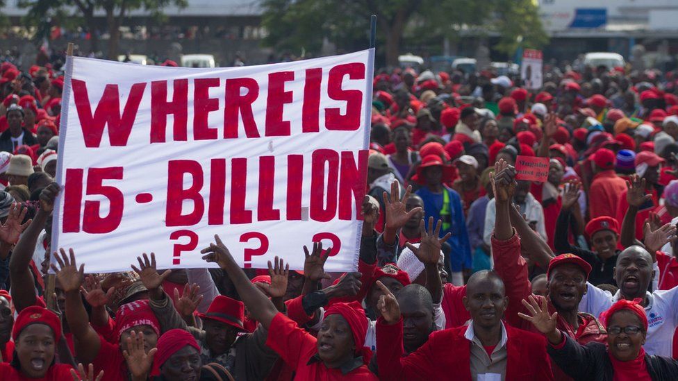 Zimbabwean opposition Movement for Democratic Change (MDC) supporters shout political slogans and hold placards during a protest against the government on 28 May 2016 in Bulawayo, Zimbabwe