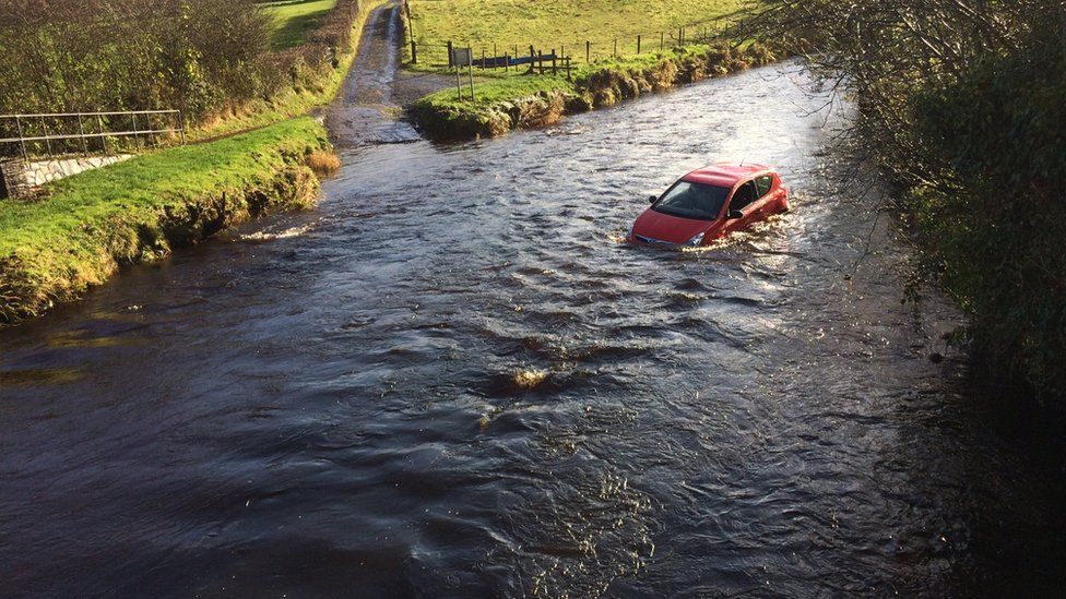 Teenagers rescued after car trapped in Stranocum river BBC News