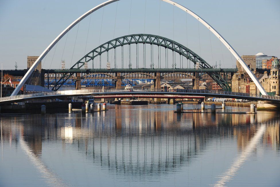 Gateshead Millennium Bridge (foreground) with Tyne Bridge (background)