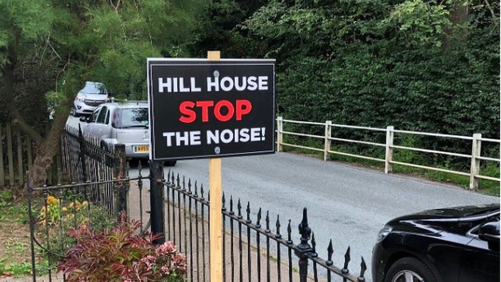 Hill House Stop The Noise placard in front garden next to road