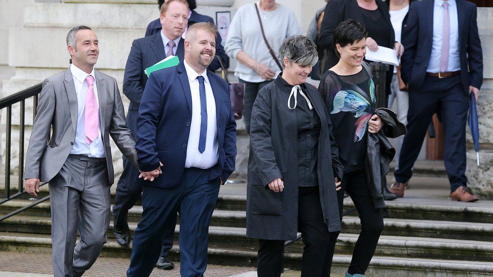 The two couples leaving court in Belfast