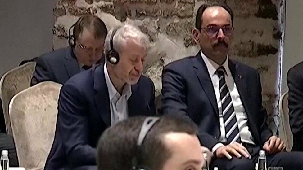 Roman Abramovich is seen sitting at a table alongside Ibrahim Kalin - a spokesman for President Recep Tayyip Erdogan