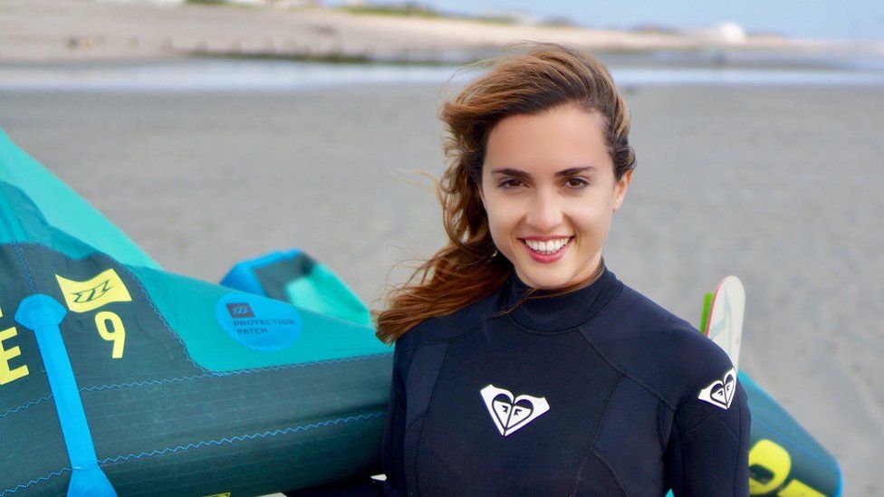 Alessandra Sollberger with kite surf equipment
