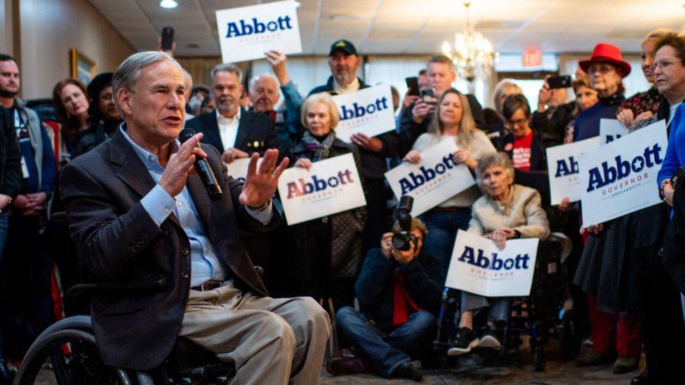Texas Governor Greg Abbott surrounded by supporters