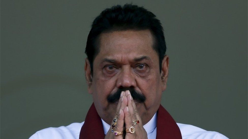 Sri Lanka"s former president Mahinda Rajapaksa, who is contesting in the upcoming general election, prays during the launch ceremony of his manifesto, in Colombo July 28, 2015