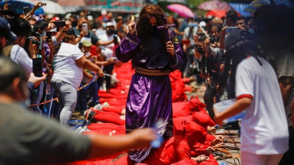 A man dressed as Jesus Nazareno participates in a ceremony known as Los Talciguines, as part of religious activities to mark the start of the Holy Week in Texistepeque, El Salvador, April 11, 2022.