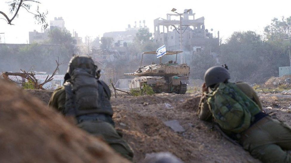 Israel Defense Forces (IDF) handout showing Israeli soldiers and a tank during a military operation inside the Gaza Strip (9 November 2023)